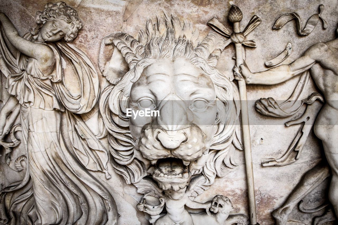 Low angle view of carvings on wall