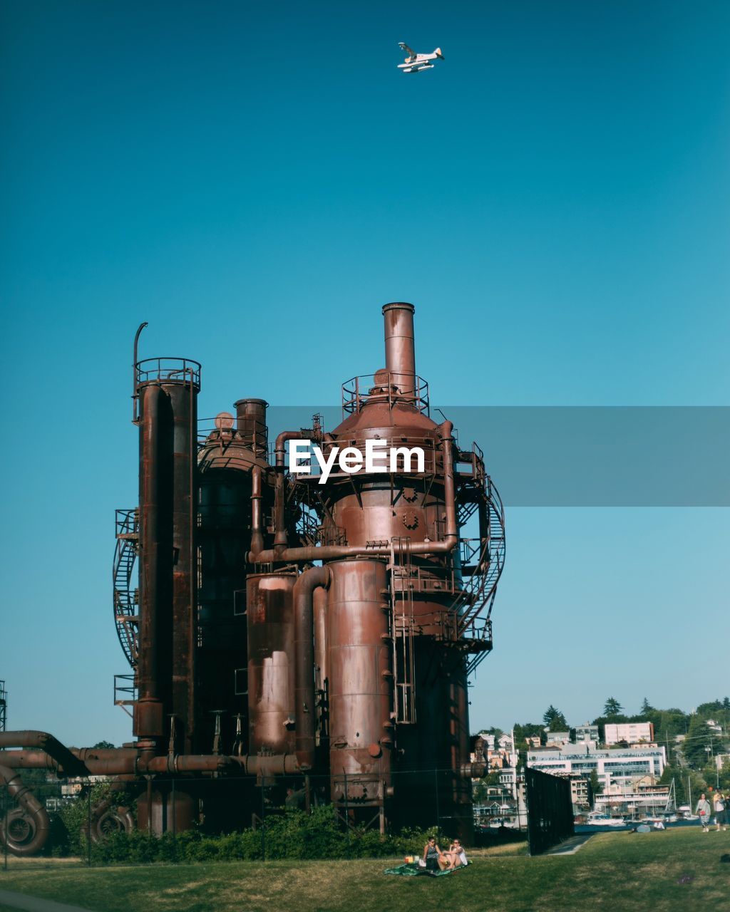 SMOKE STACK AGAINST BLUE SKY