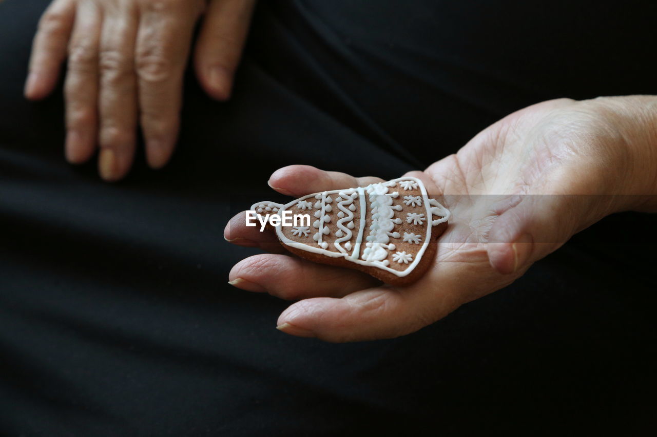 Close-up of hand holding cookie