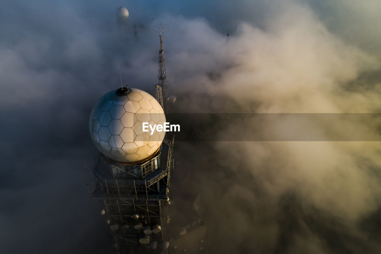 Aerial view building amidst cloud