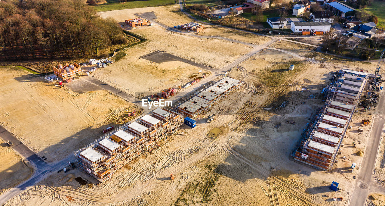 Aerial view of the shell of a large terraced house in a new development area 