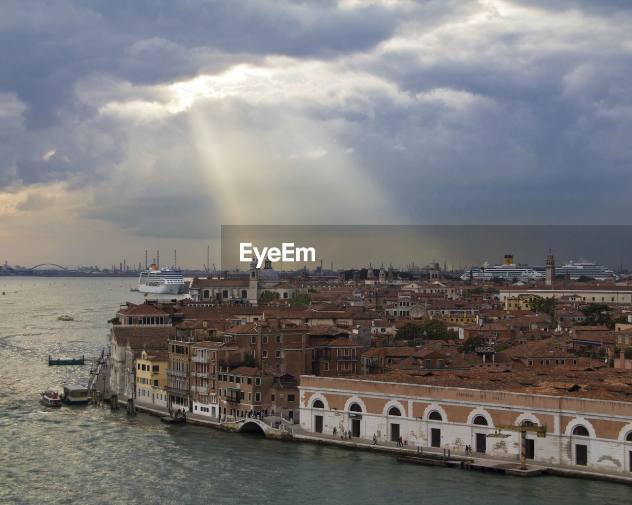 High angle view of island by grand canal against cloudy sky