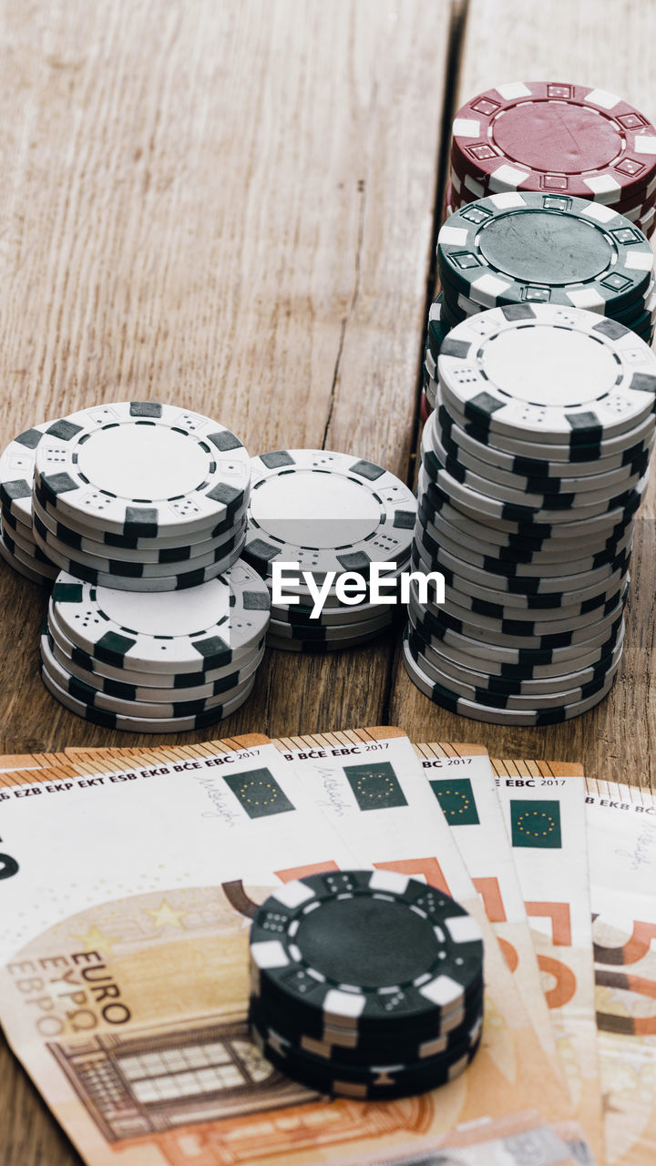 high angle view of coins in container on table