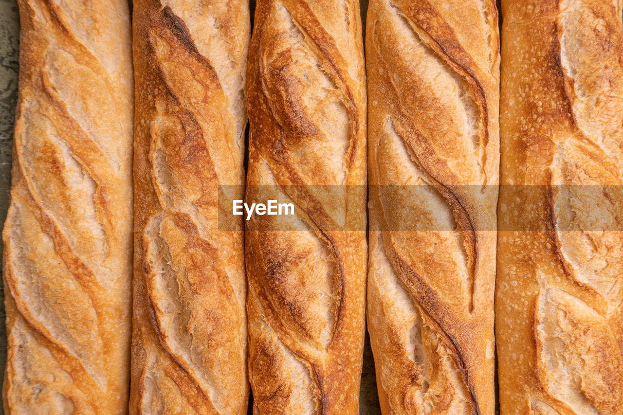 food, full frame, backgrounds, no people, pattern, brown, baked, close-up, bread, dessert, textured, snack, baguette, food and drink, loaf of bread, indoors