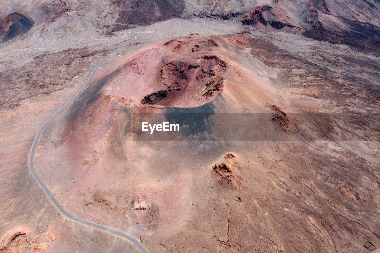 HIGH ANGLE VIEW OF ROCK FORMATIONS ON LAND