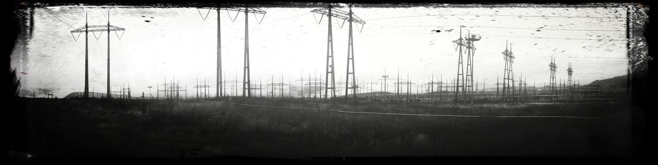 cable, power line, electricity pylon, no people, day, outdoors, railroad track, electricity, built structure, sky, architecture, telephone line, nature, tree