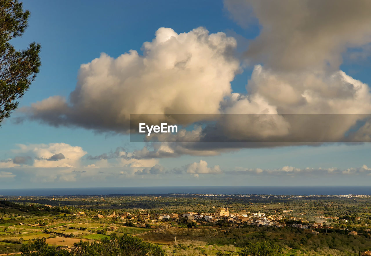 Scenic view of sea and buildings against sky