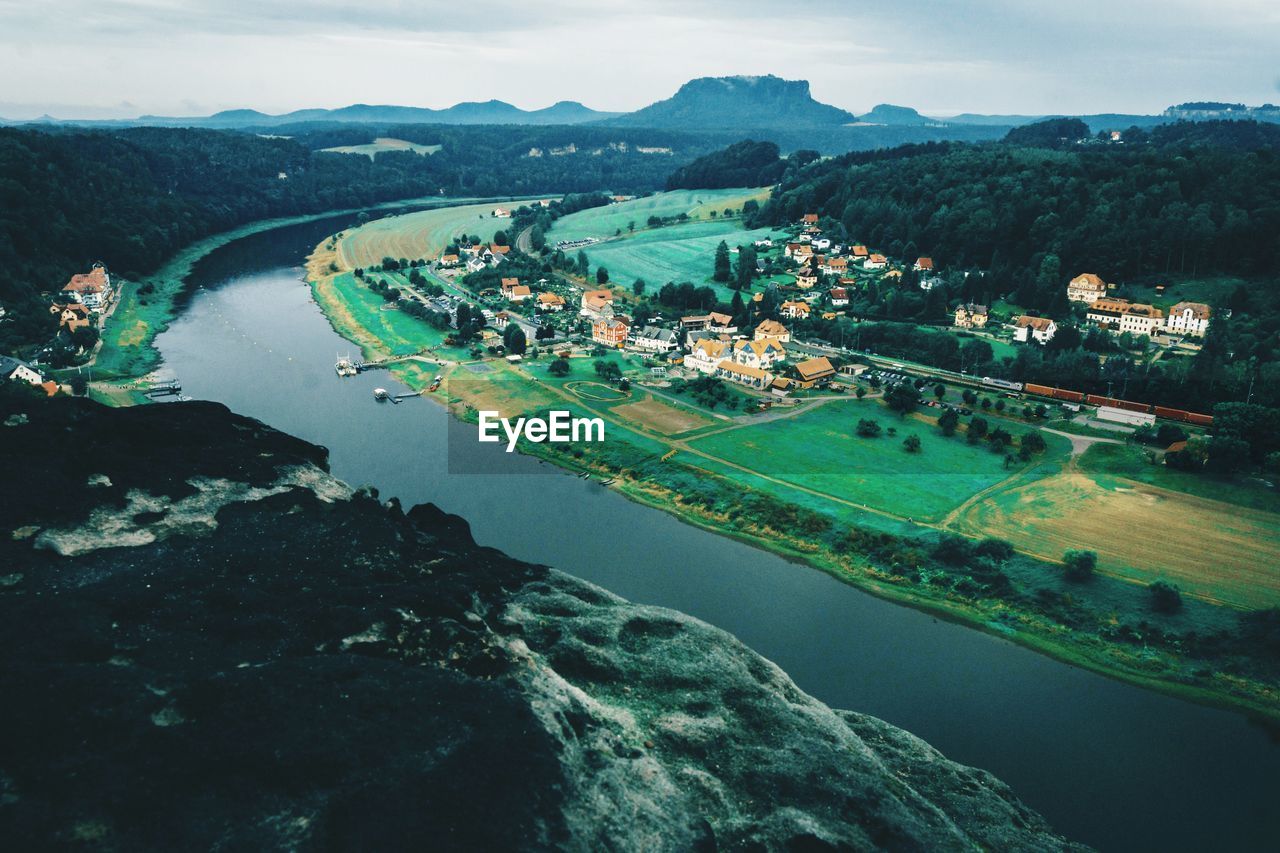 High angle view of sea and city against sky