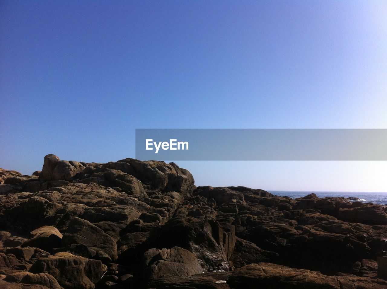 View of rocks against clear sky