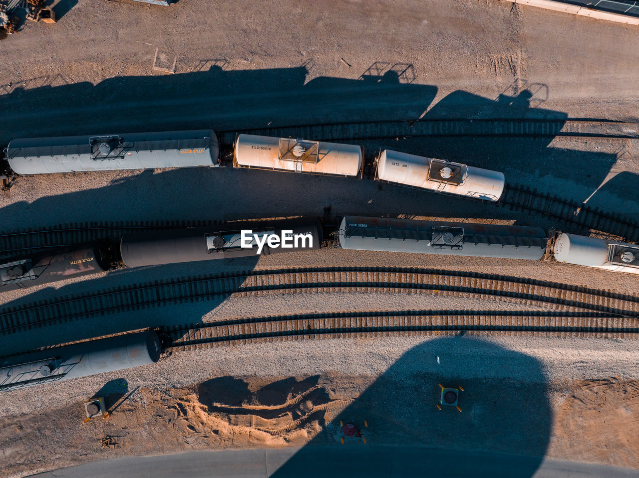 Cargo train waiting to be filled in an oil refineries.