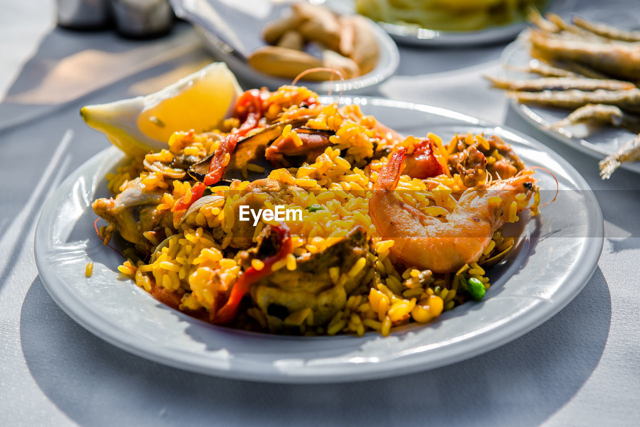 High angle view of paella served in plate on table