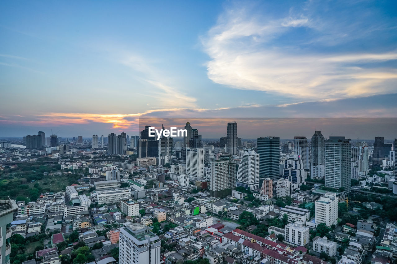 High angle view of city at sunset