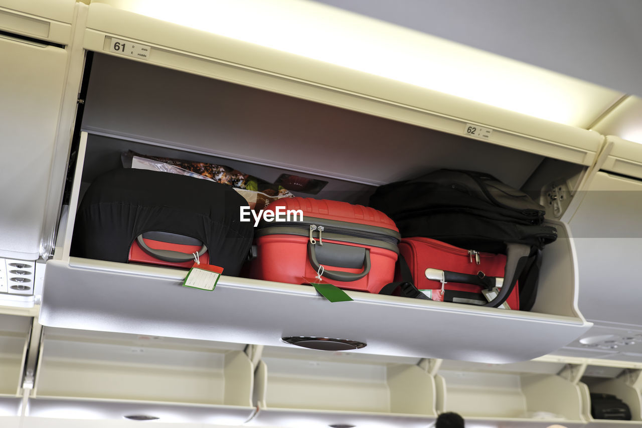 Low angle view of luggage in airplane