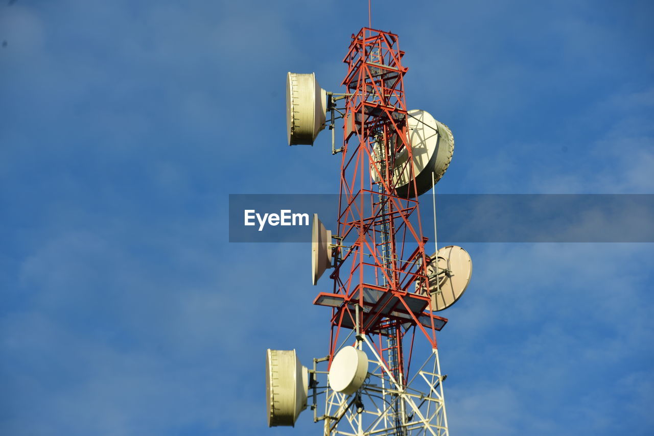 blue, global communications, sky, technology, satellite, broadcasting, communication, satellite dish, communications tower, telecommunications engineering, low angle view, electricity, wireless technology, telecommunications equipment, antenna, tower, cloud, nature, no people, television industry, architecture, built structure, computer network, day, outdoors, metal, internet, radio, radio wave, equipment, global business