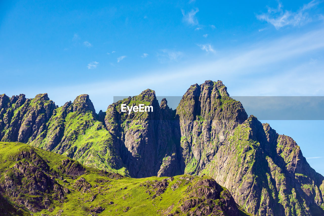 PANORAMIC VIEW OF ROCKS AND MOUNTAIN AGAINST SKY