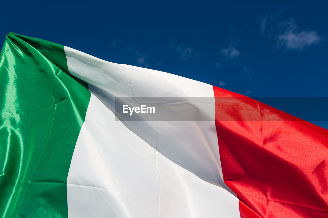 Close-up of italian flag against sky