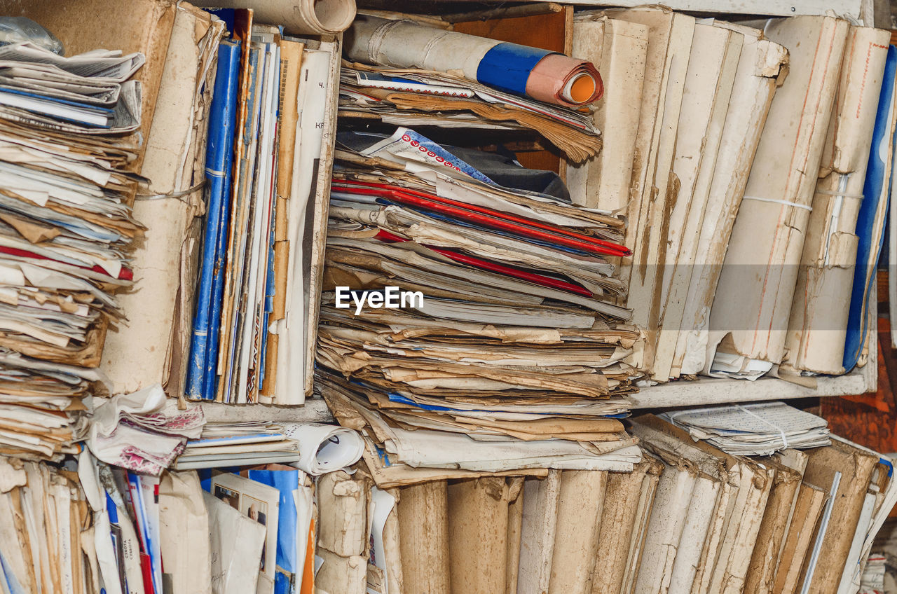 Old paper documents on shelves