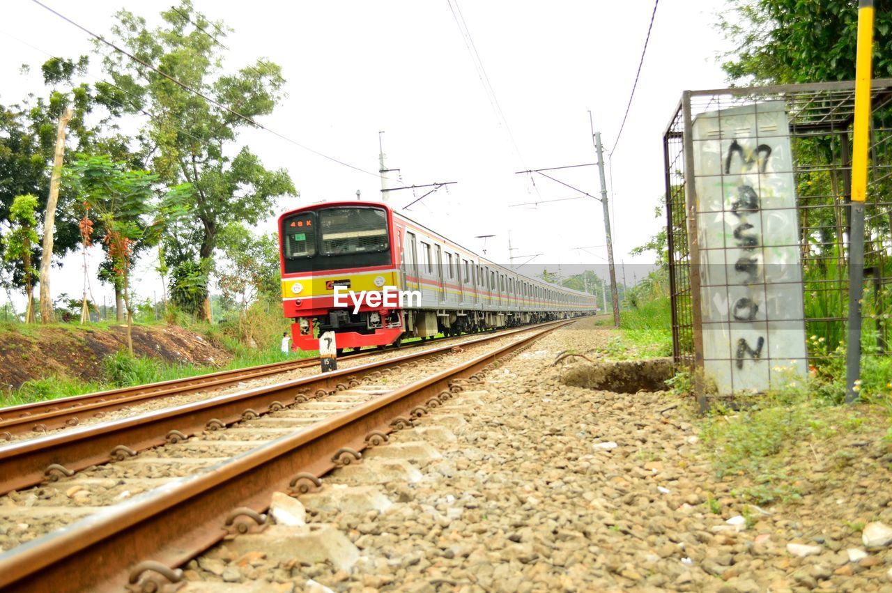 Train on railroad tracks against sky