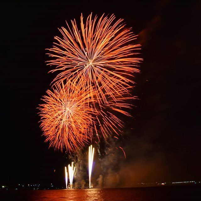 LOW ANGLE VIEW OF FIREWORKS DISPLAY