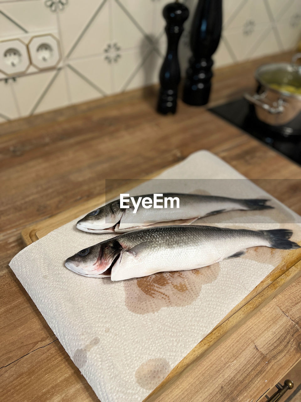 CLOSE-UP OF FISH ON TABLE