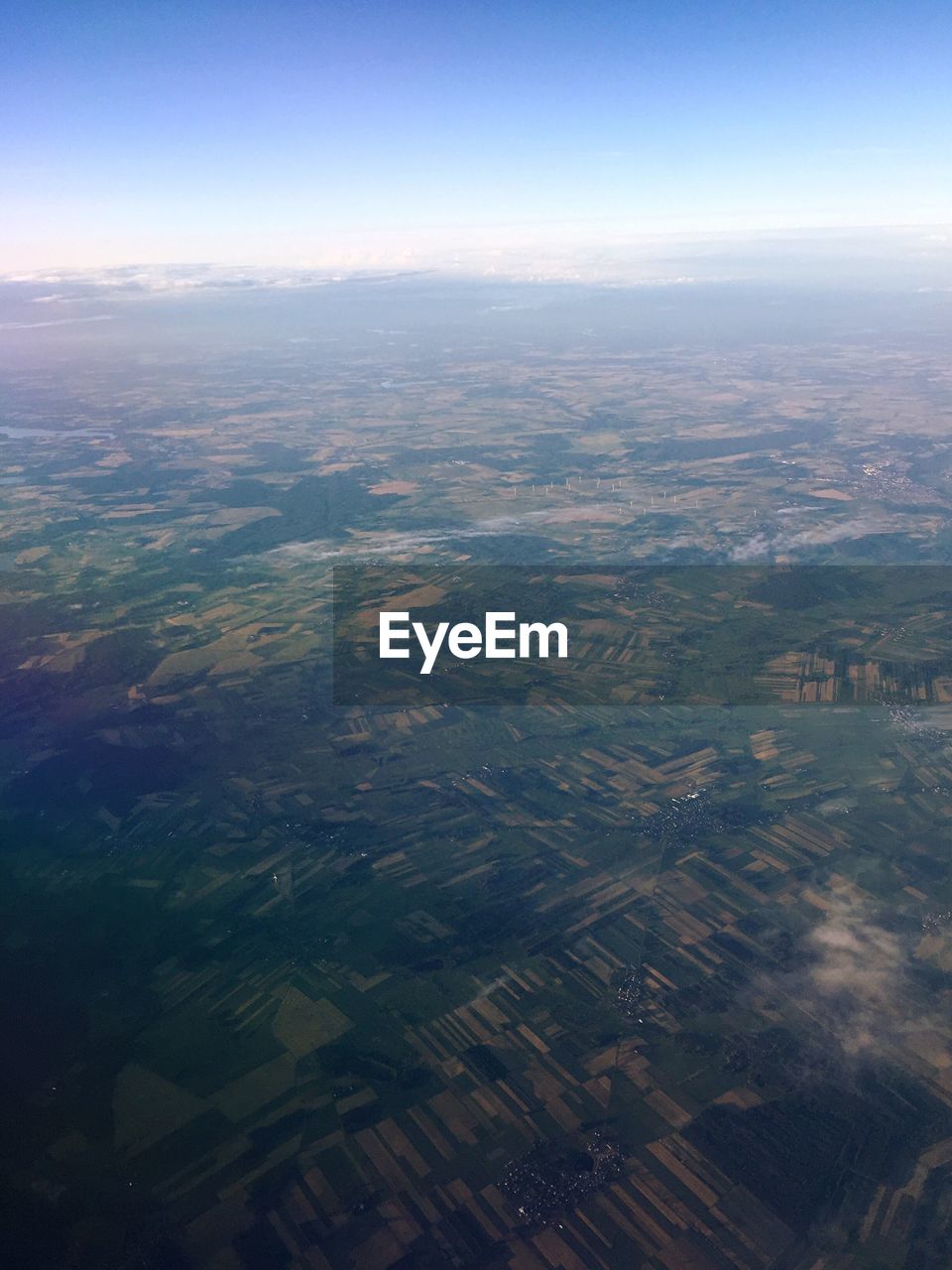 Aerial view of agricultural field against sky