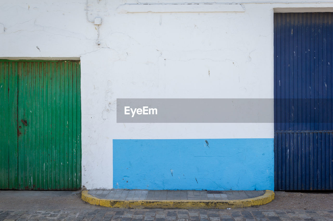 CLOSED DOOR OF BLUE HOUSE