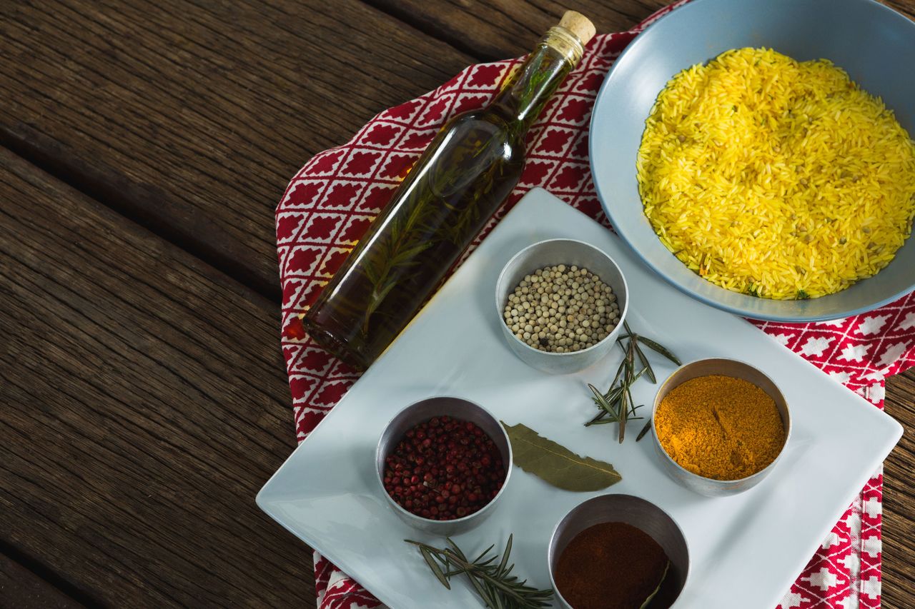 Close-up of rice in bowl with various spices ingredients