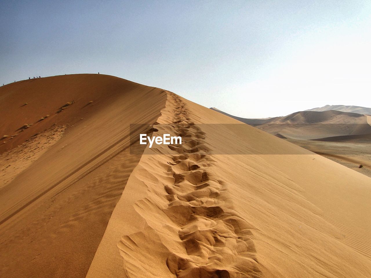 Idyllic shot of sand dune against clear sky at namib desert