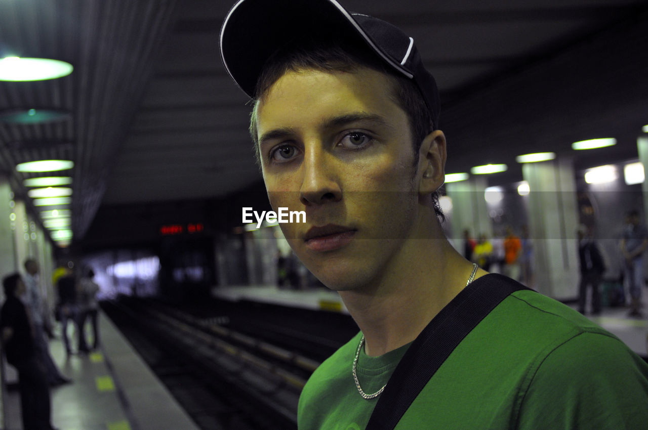 Portrait of man at subway station