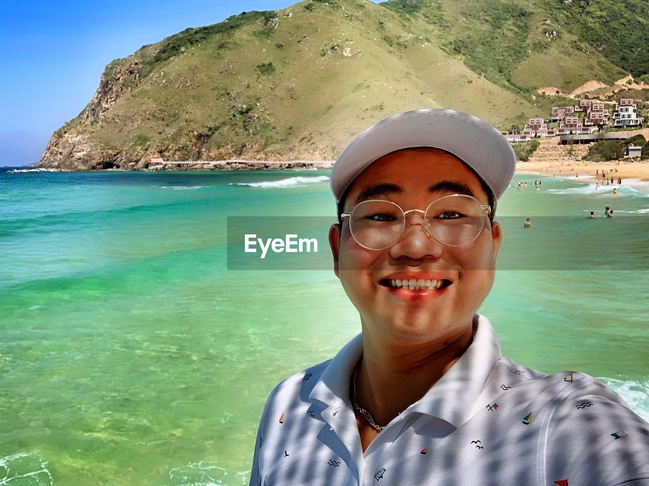 PORTRAIT OF SMILING MAN IN SEA