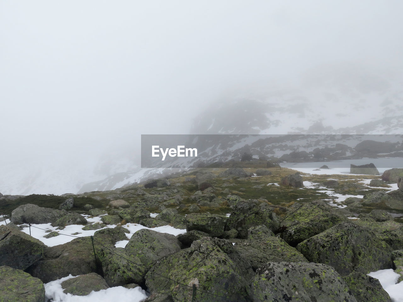 Scenic view of mountains against sky during winter