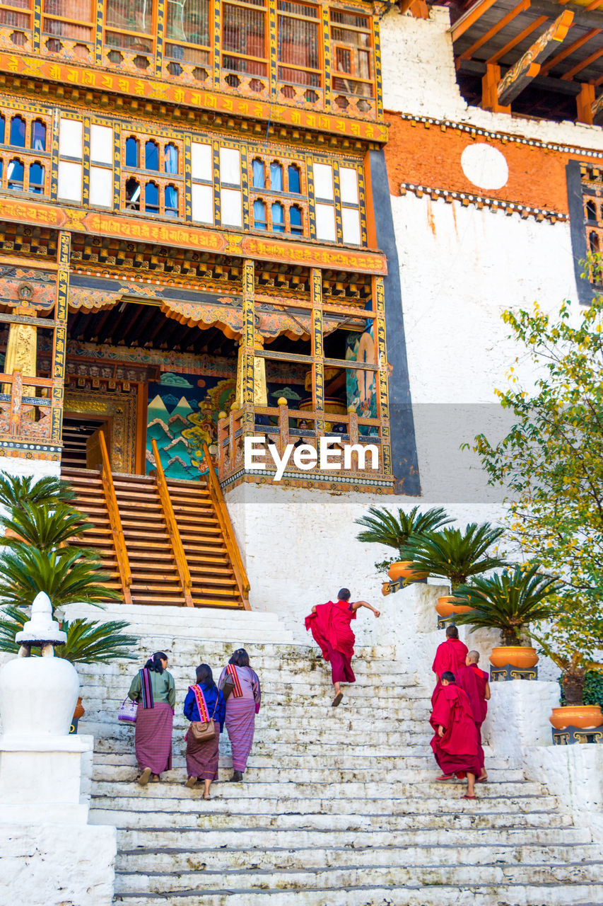 People walking on temple steps