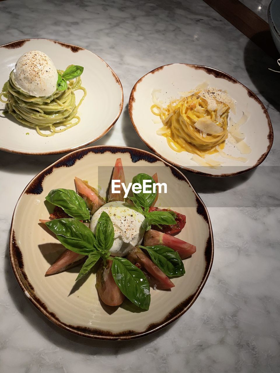 HIGH ANGLE VIEW OF SALAD SERVED ON TABLE