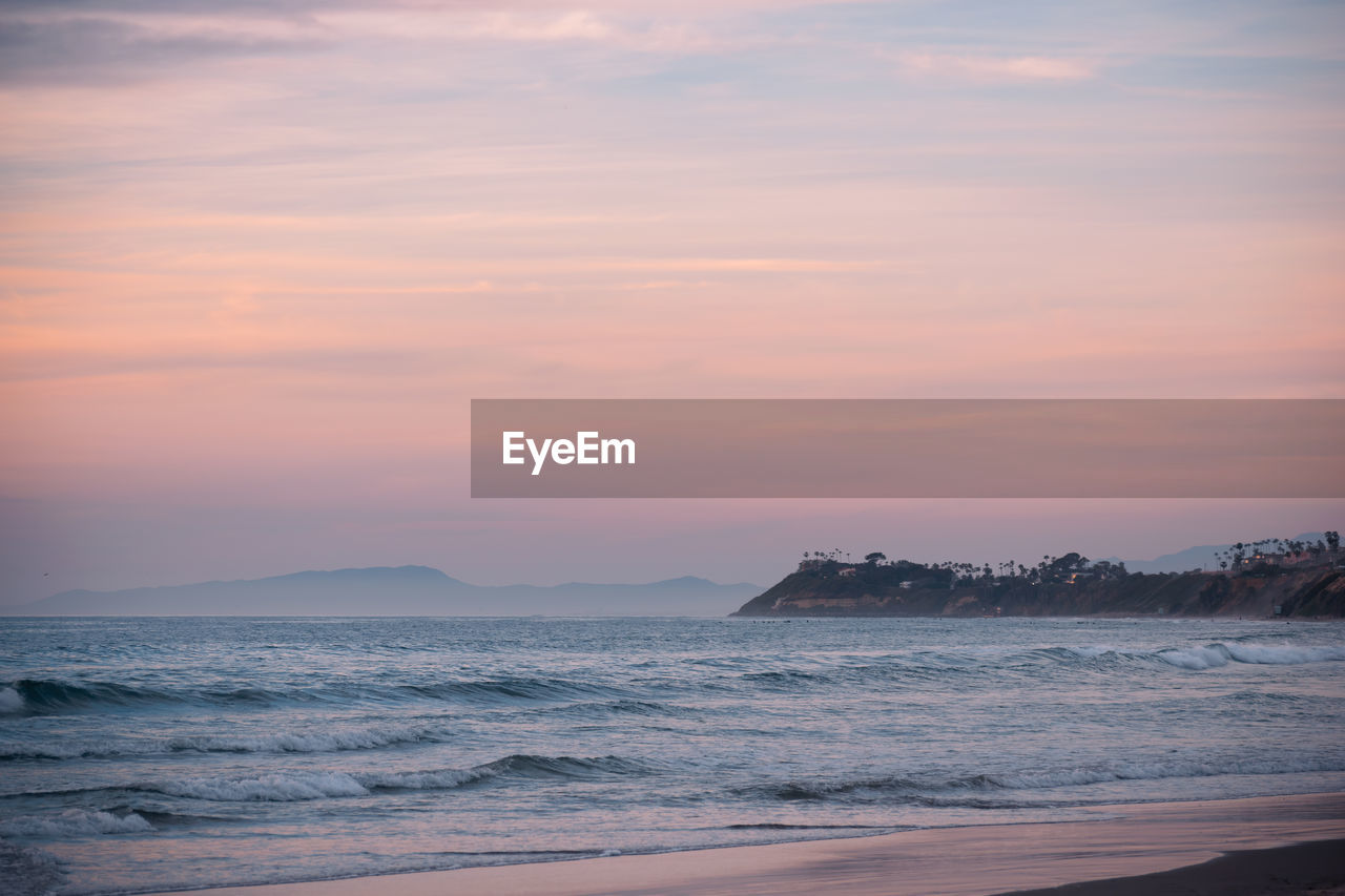 Scenic view of sea against sky during sunset