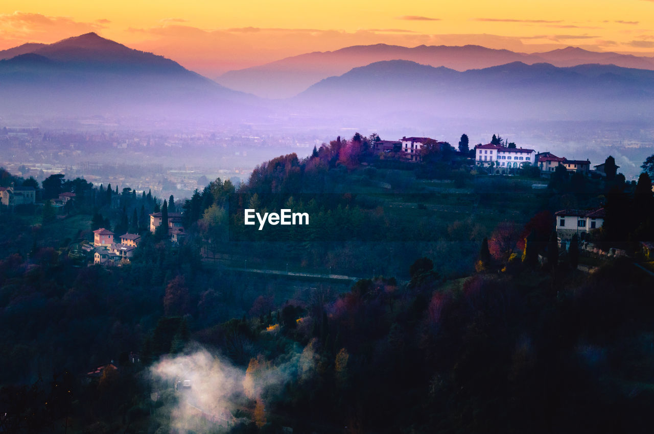 Scenic view of mountains against sky during sunset