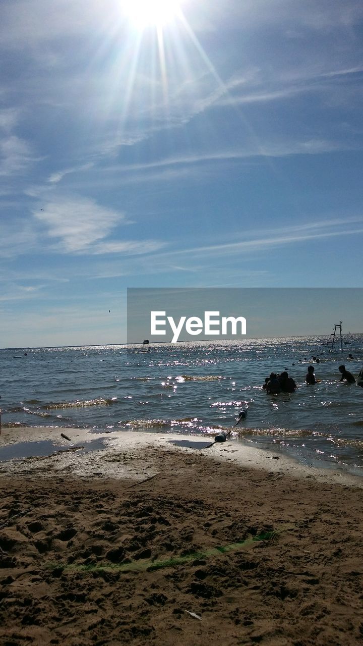 Scenic view of beach against blue sky