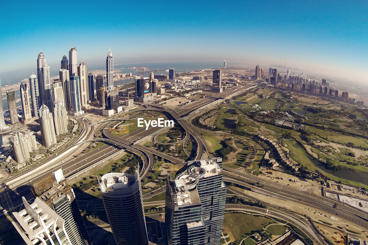 High angle view of city buildings against sky