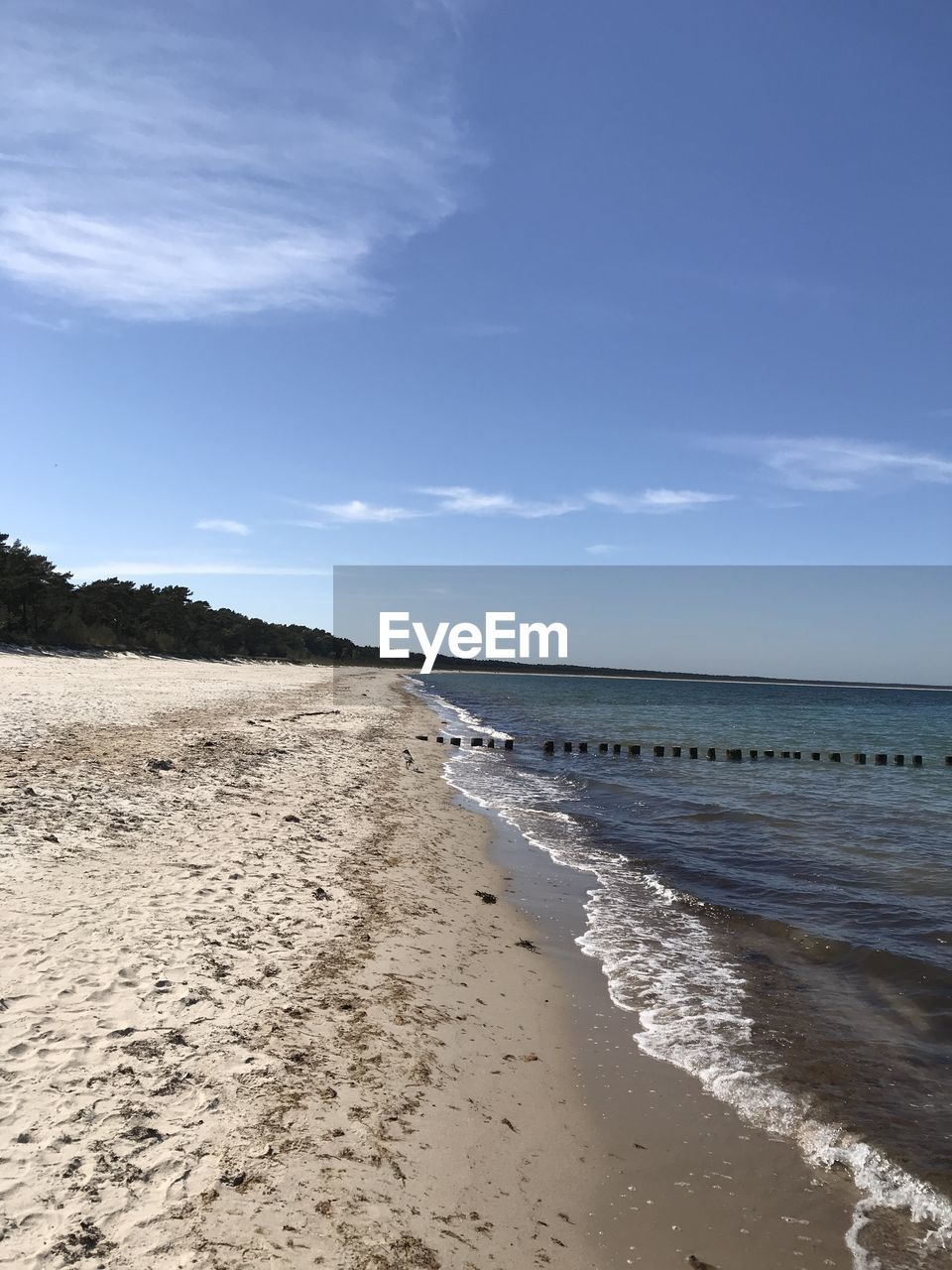 PANORAMIC VIEW OF BEACH AGAINST SKY