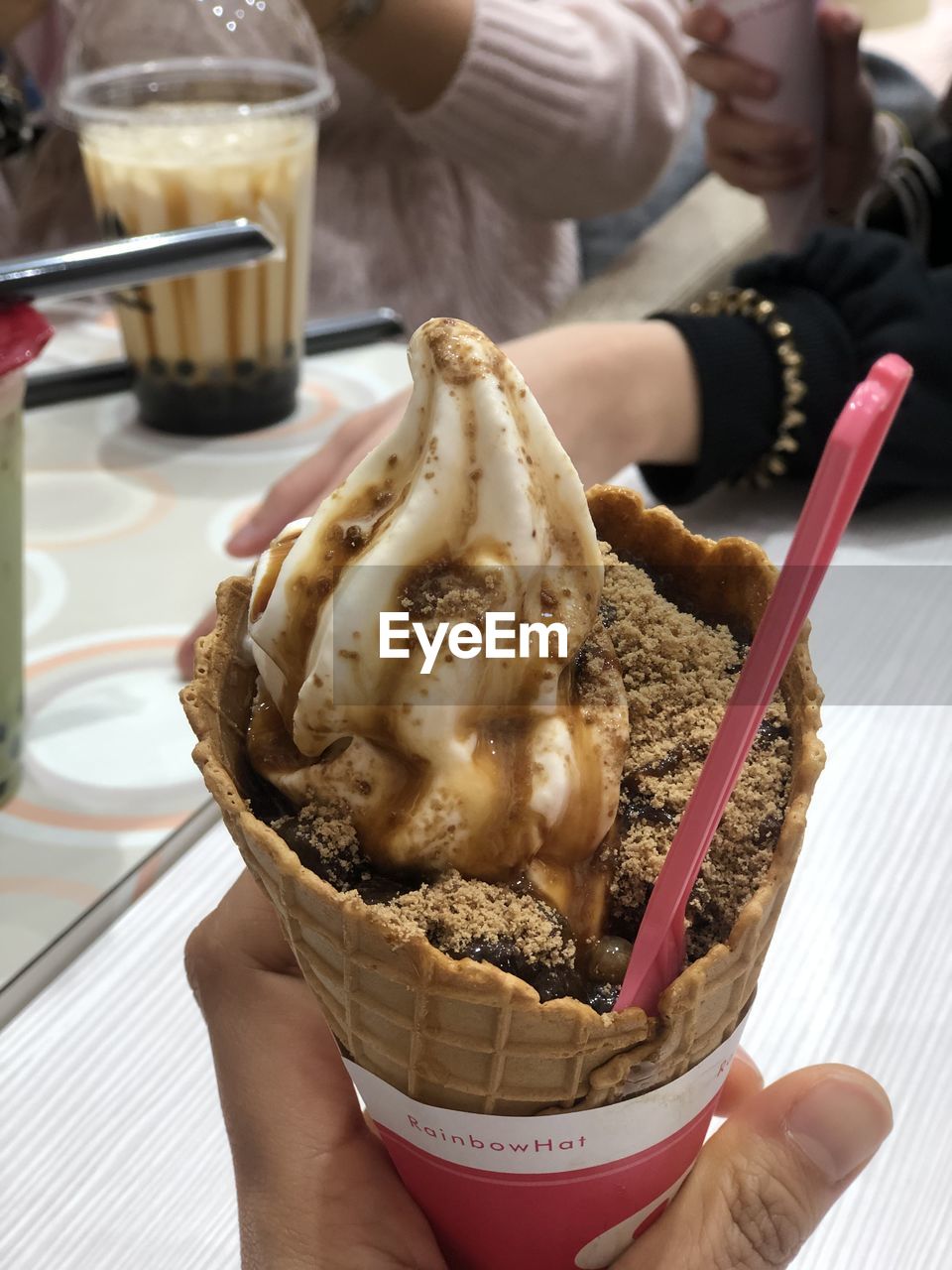 Midsection of person holding ice cream