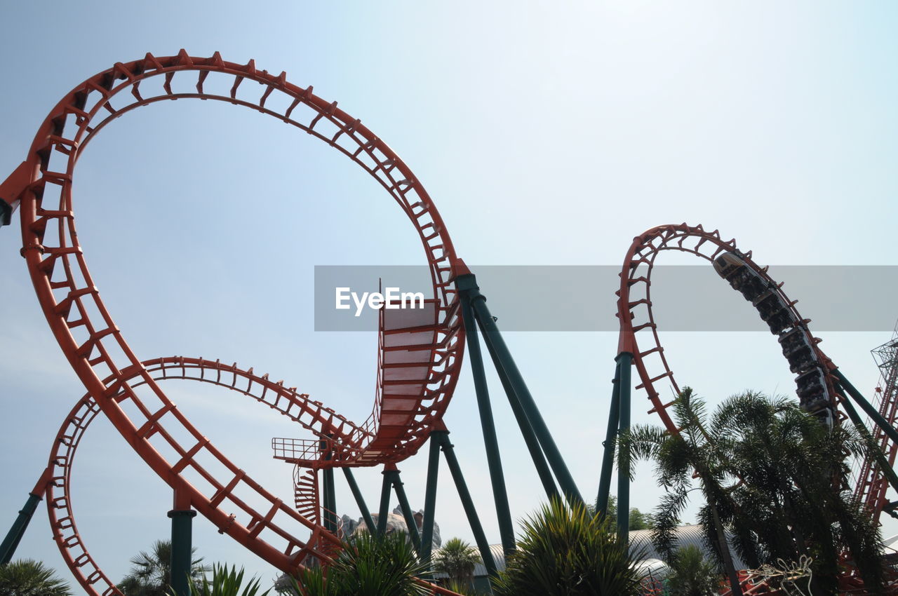 Low angle view of rollercoaster against sky