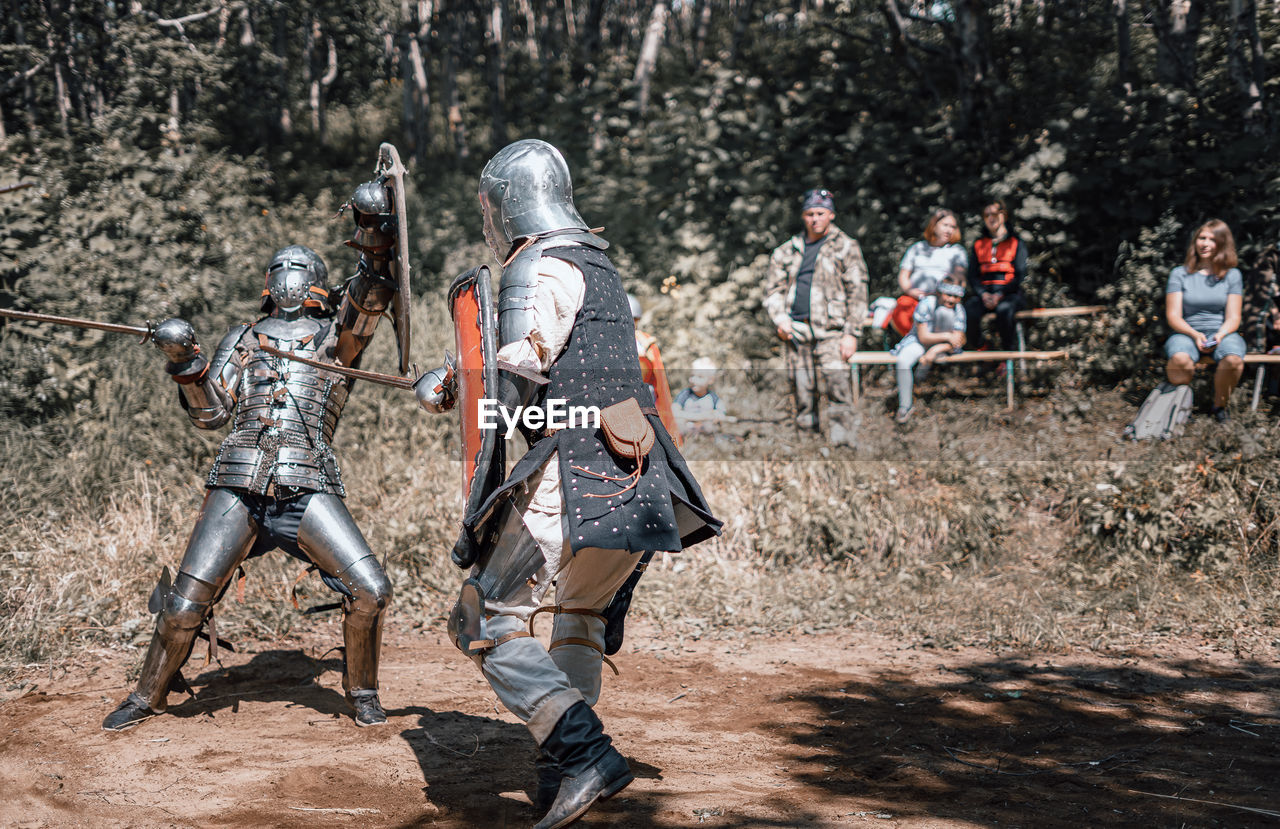 View of warrior standing on field