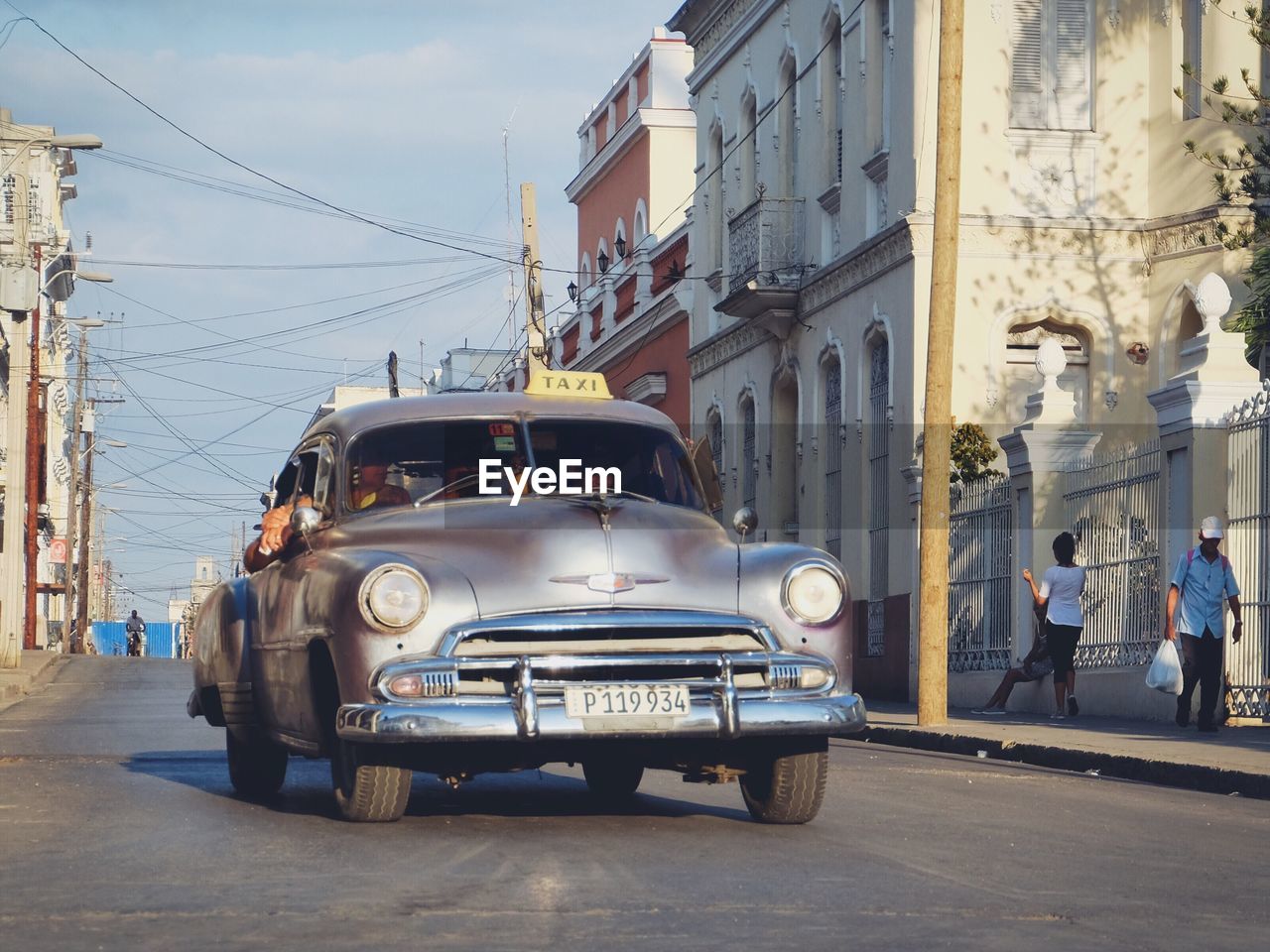 CAR ON STREET IN CITY