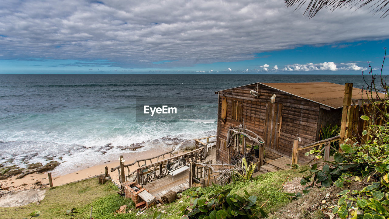 Scenic view of sea against cloudy sky