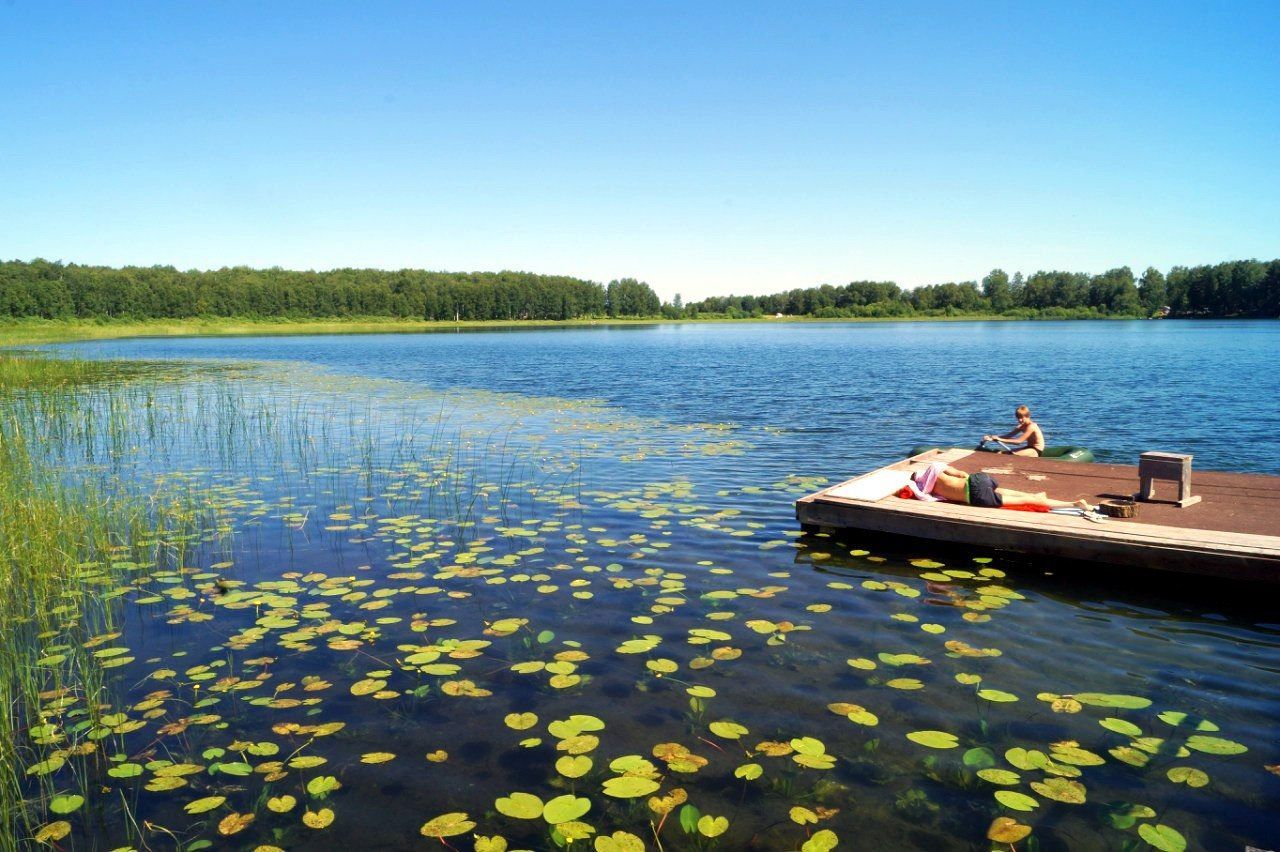 BOAT FLOATING ON LAKE AGAINST SKY