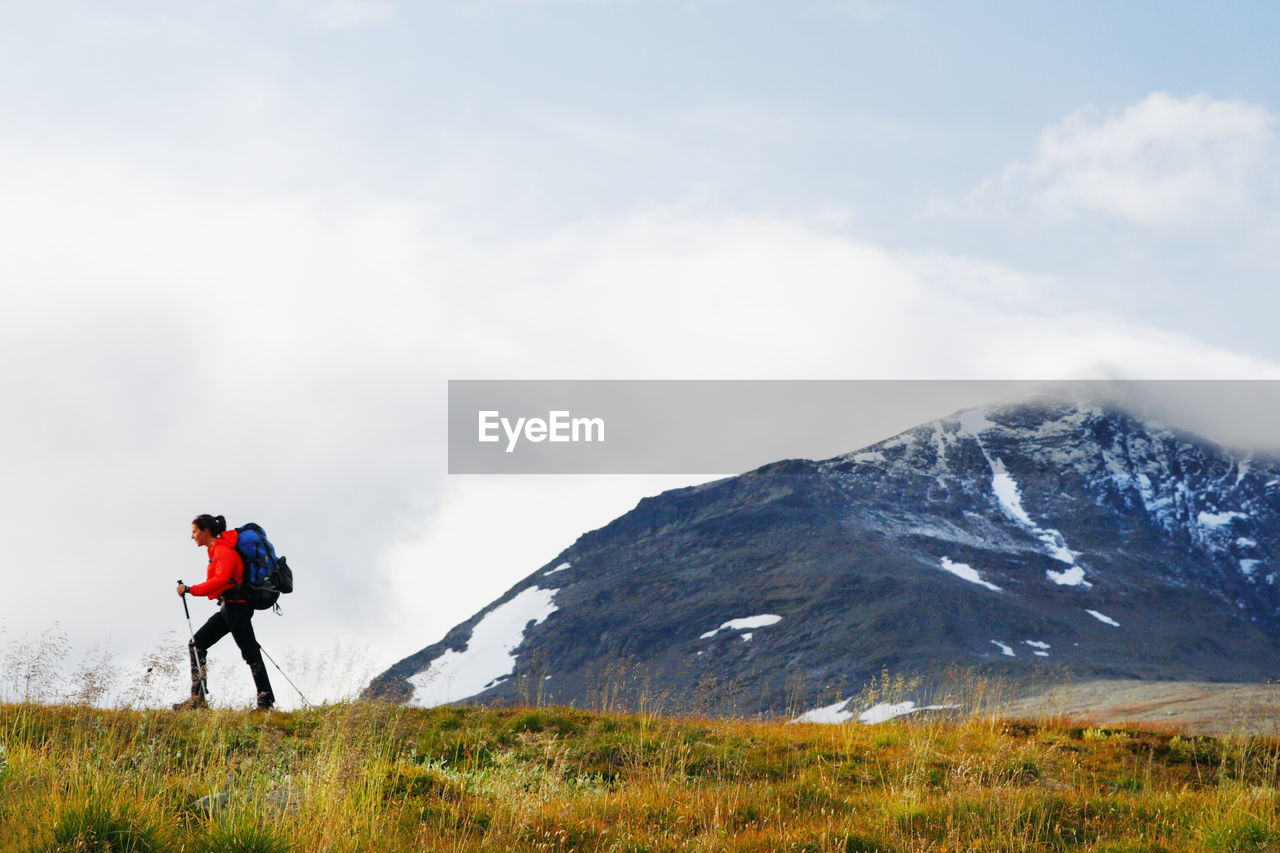 Woman hiking in mountains  on the move