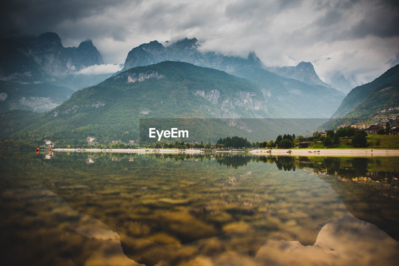 Scenic view of lake and mountains against sky