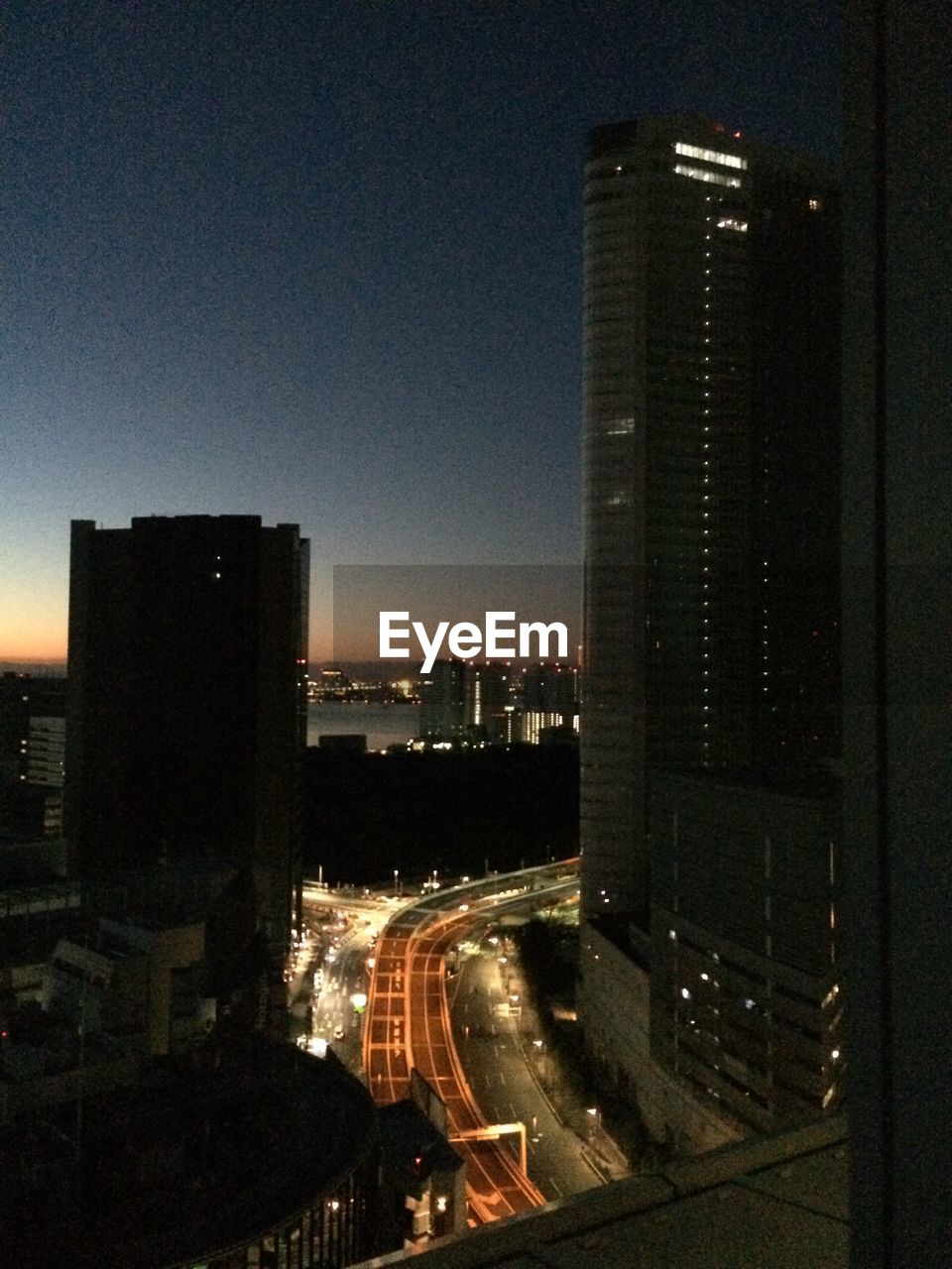 ILLUMINATED CITYSCAPE AT NIGHT