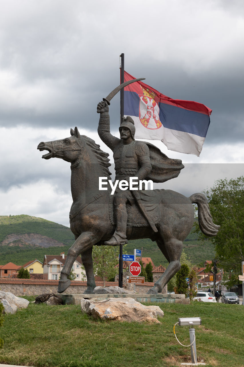 STATUE AGAINST SKY