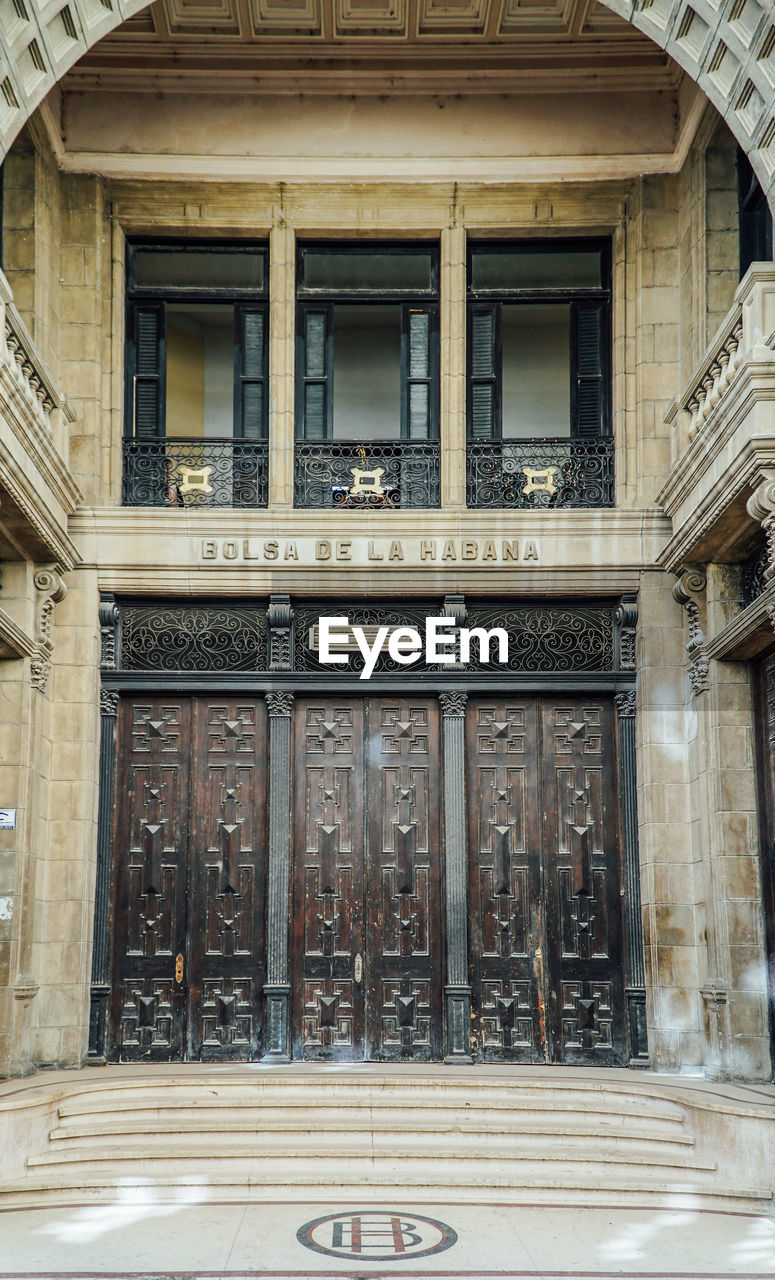 LOW ANGLE VIEW OF BUILDING WITH CLOSED WINDOWS