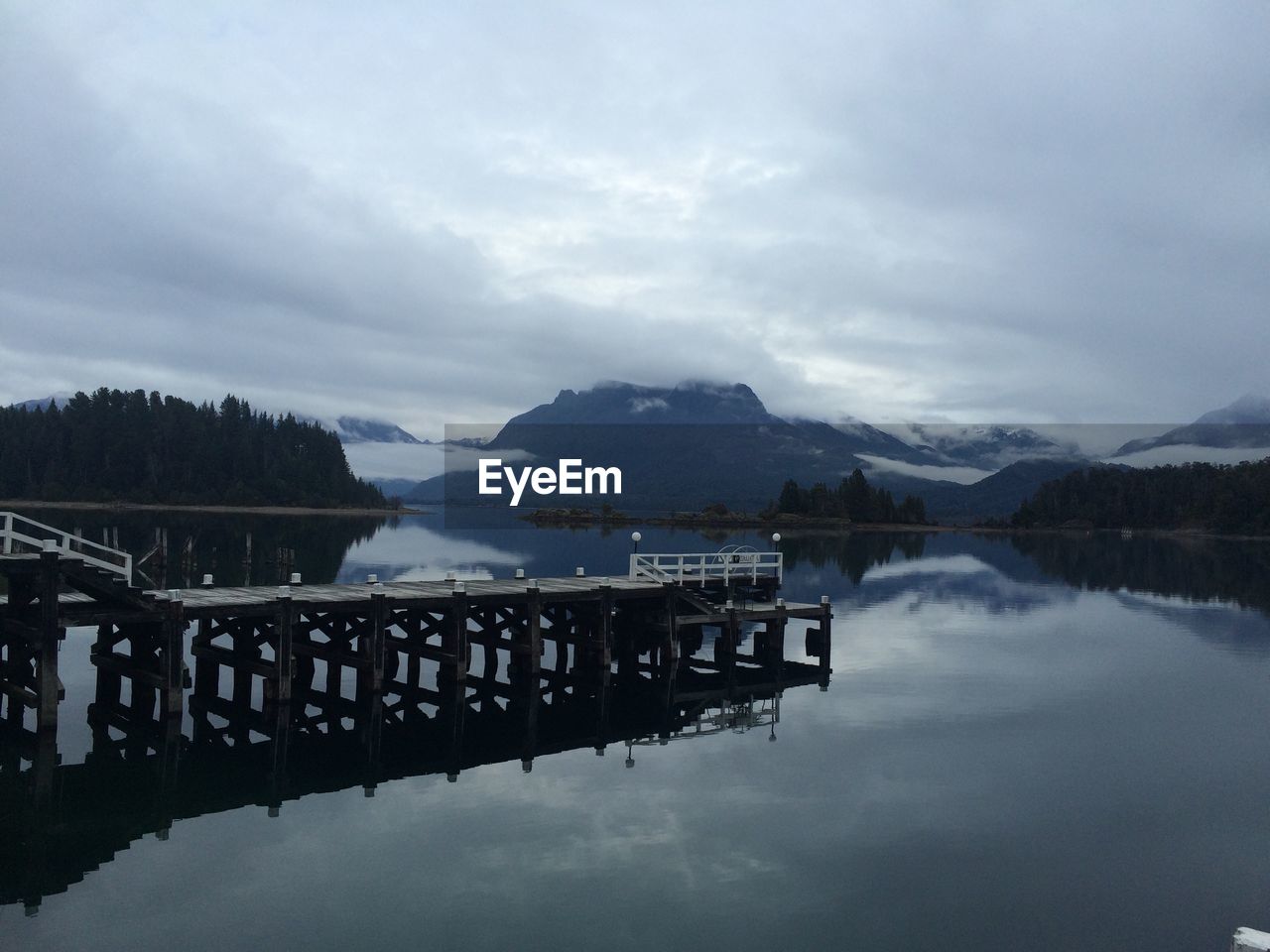 Scenic view of lake against cloudy sky